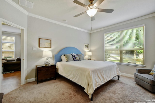 bedroom with ceiling fan, crown molding, and wood-type flooring