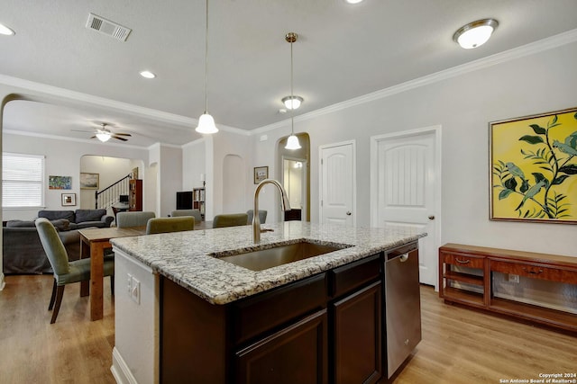 kitchen featuring sink, light hardwood / wood-style flooring, light stone counters, dishwasher, and ceiling fan