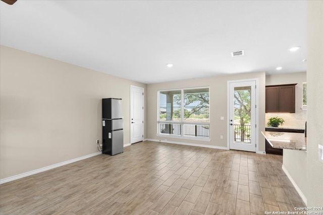 foyer with light wood-type flooring