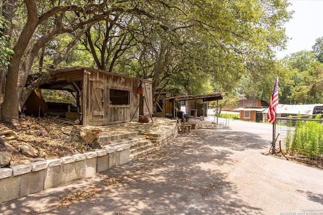 view of front of property with an outdoor structure