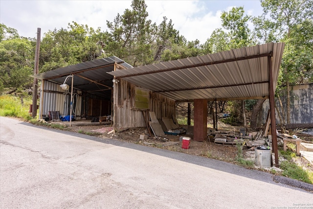 exterior space featuring a carport