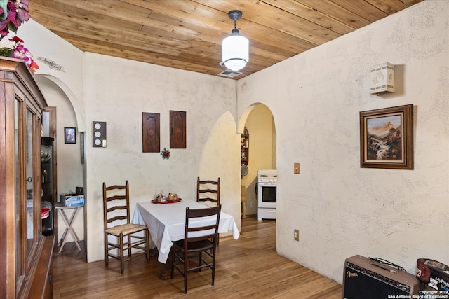 dining room featuring wooden ceiling and hardwood / wood-style floors