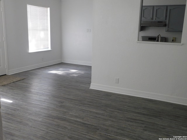 spare room featuring dark hardwood / wood-style flooring