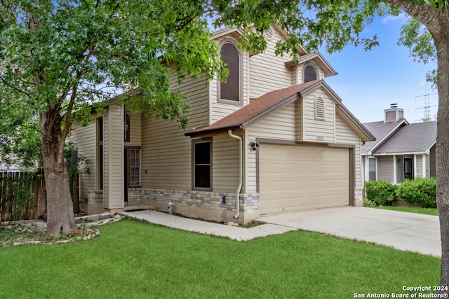 view of front facade featuring a garage and a front lawn