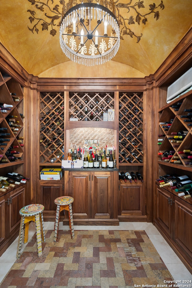 wine area featuring vaulted ceiling