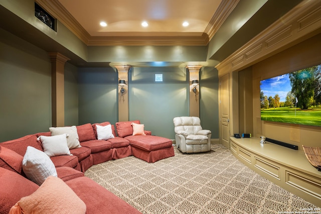 cinema room featuring ornate columns, crown molding, and carpet