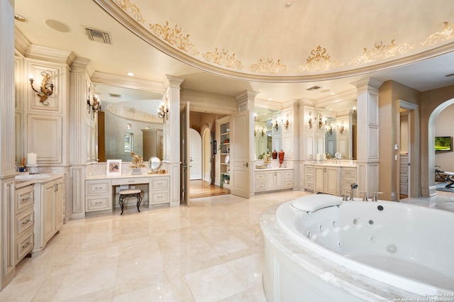 bathroom featuring a bathing tub, vanity, a towering ceiling, and crown molding