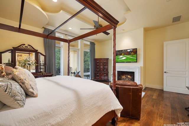 bedroom featuring access to exterior, ceiling fan, and dark hardwood / wood-style floors