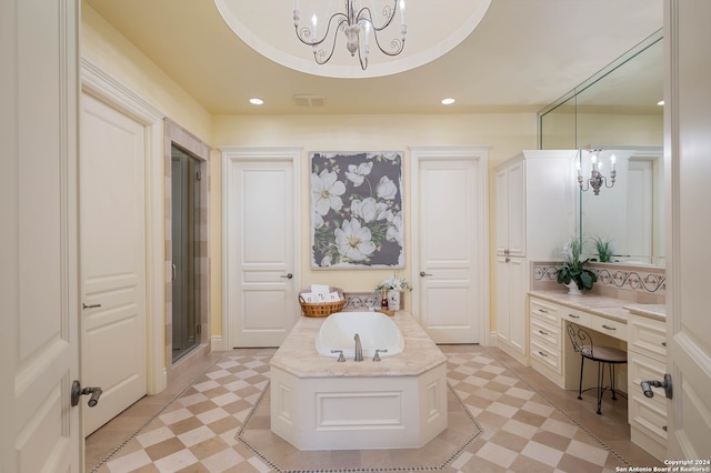 bathroom featuring a notable chandelier, vanity, and plus walk in shower