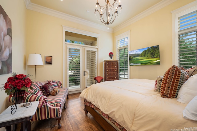 bedroom featuring multiple windows, a chandelier, dark wood-type flooring, and ornamental molding