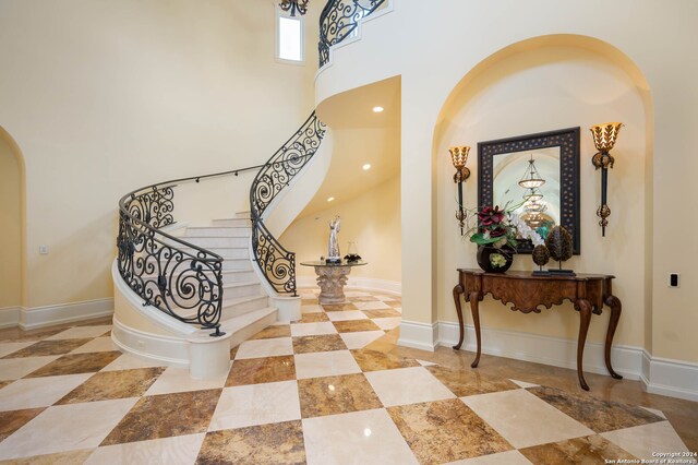 entrance foyer featuring a towering ceiling