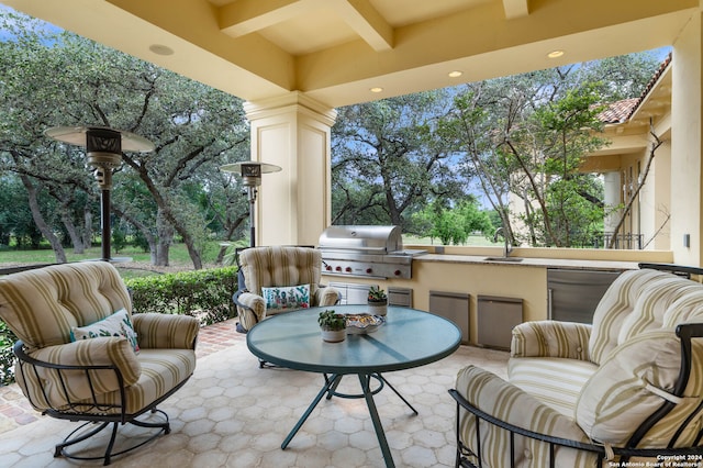 view of patio / terrace featuring an outdoor living space, an outdoor kitchen, area for grilling, and sink