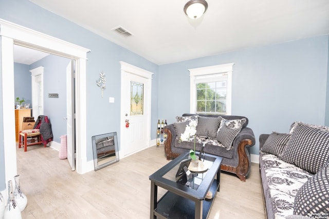 living room with light hardwood / wood-style flooring