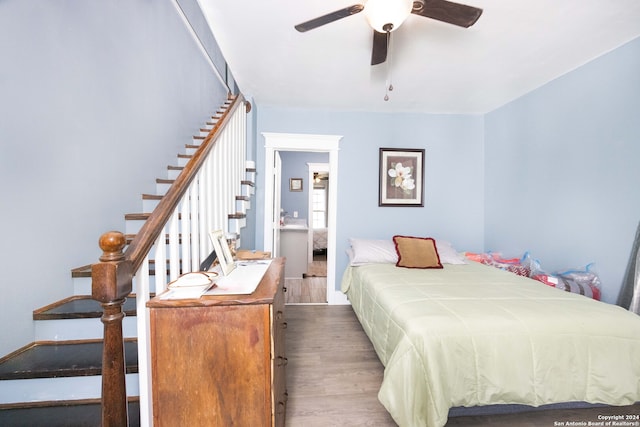 bedroom featuring hardwood / wood-style flooring and ceiling fan