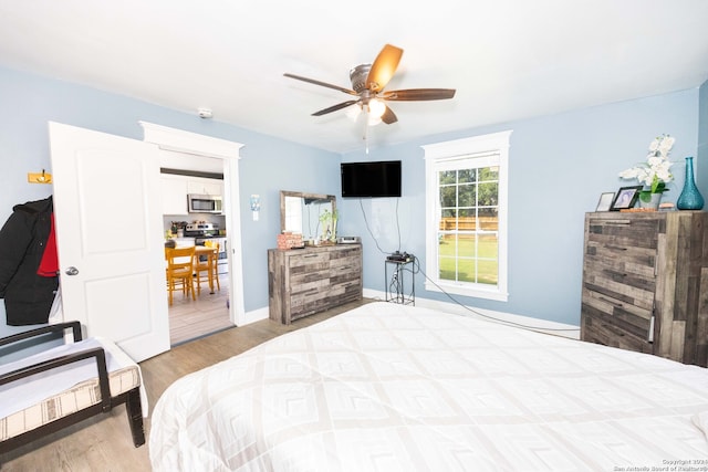 bedroom featuring ceiling fan and light hardwood / wood-style flooring