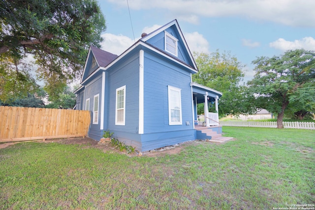 view of home's exterior featuring a yard