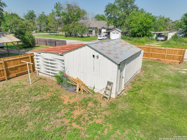 view of shed / structure with a lawn