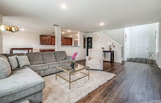 living room with dark hardwood / wood-style floors