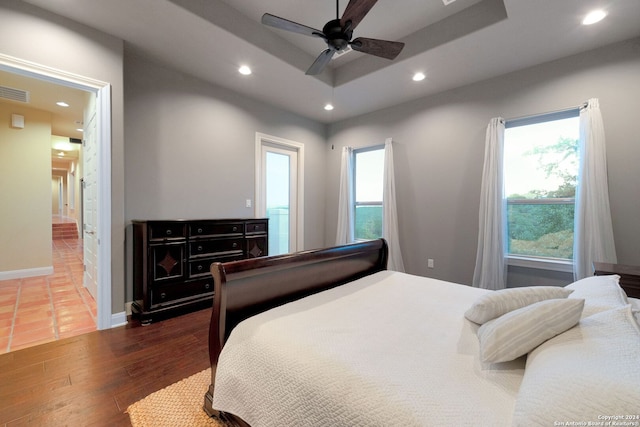 bedroom featuring dark hardwood / wood-style floors and ceiling fan