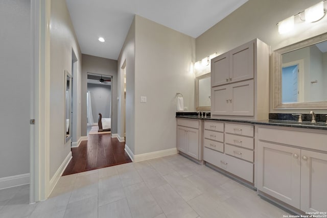 bathroom featuring tile floors and double sink vanity