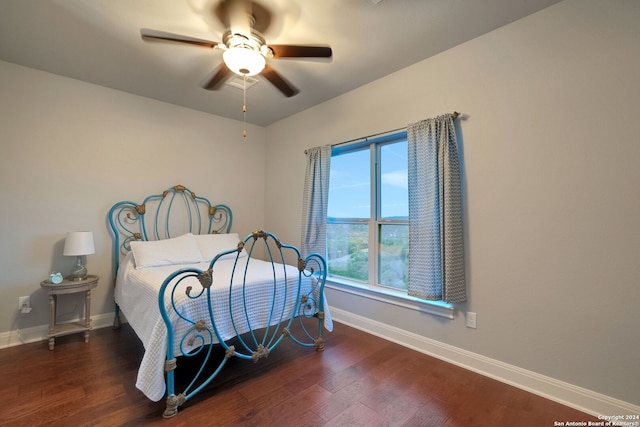 bedroom featuring dark wood-type flooring and ceiling fan