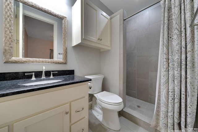 bathroom featuring a shower with curtain, oversized vanity, toilet, and tile floors