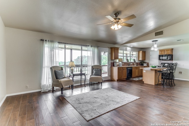 living room with dark hardwood / wood-style floors, ceiling fan, and lofted ceiling