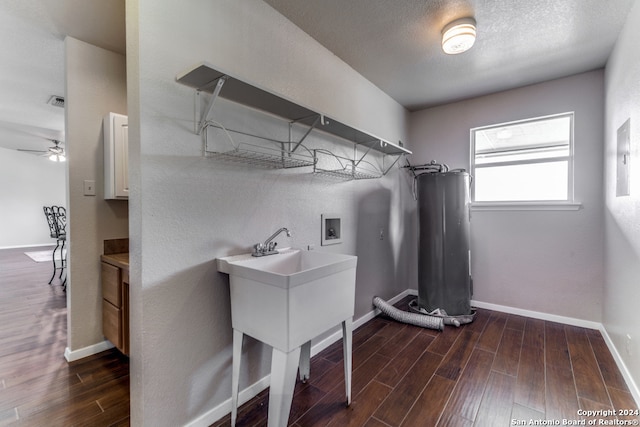 washroom featuring electric water heater, ceiling fan, washer hookup, and hardwood / wood-style floors