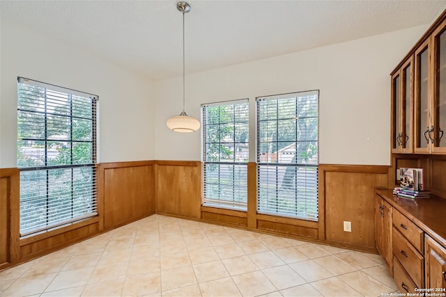 dining room featuring wooden walls