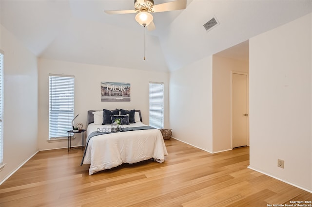 bedroom featuring lofted ceiling, ceiling fan, and light hardwood / wood-style floors