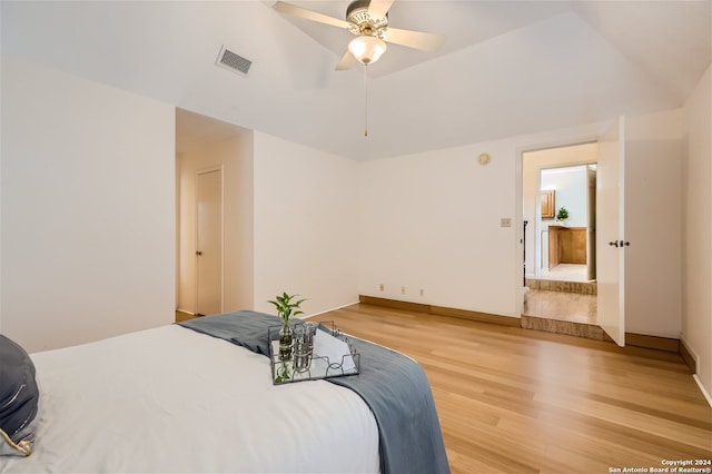 bedroom with hardwood / wood-style flooring and ceiling fan