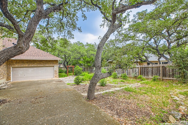 view of yard with a garage