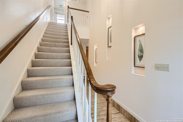 stairway featuring hardwood / wood-style floors