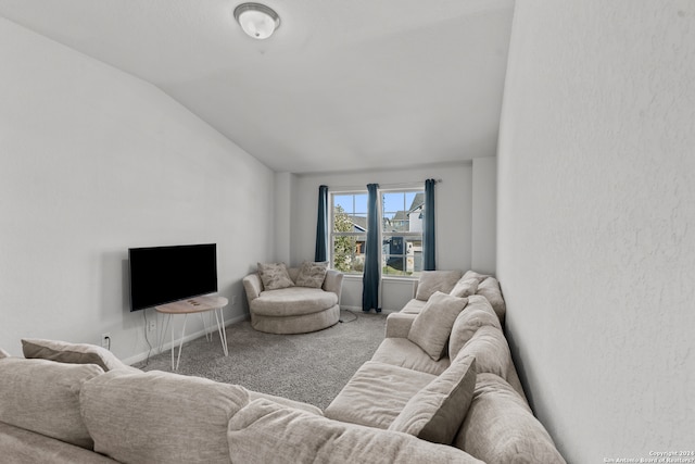 carpeted living room featuring vaulted ceiling