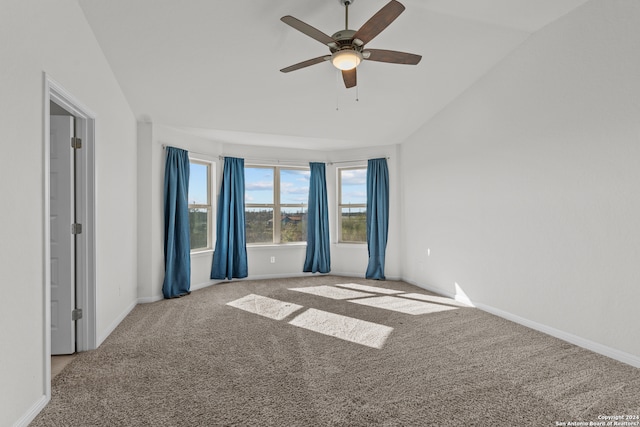 carpeted spare room with lofted ceiling and ceiling fan