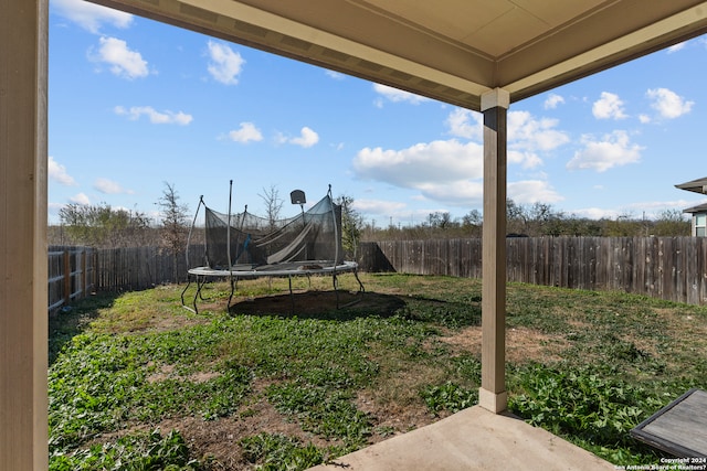 view of yard with a trampoline