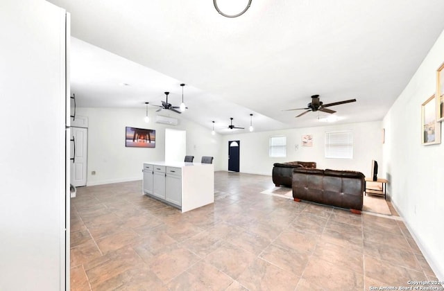 living room with lofted ceiling, ceiling fan, and light tile floors