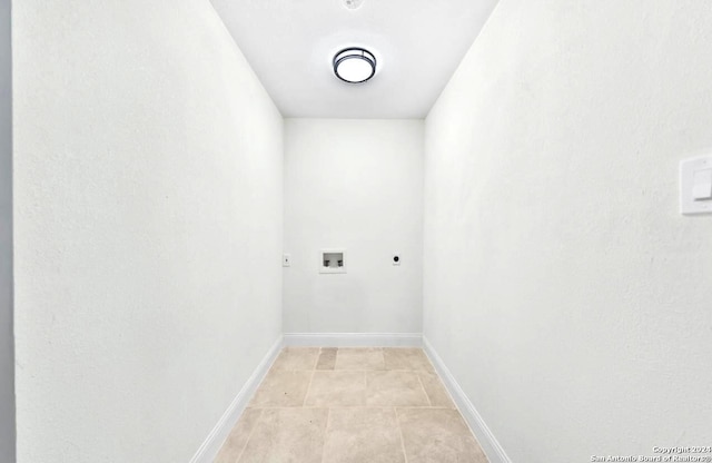 laundry area with hookup for a washing machine, light tile flooring, and hookup for an electric dryer