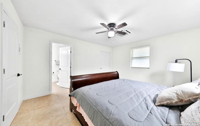 tiled bedroom featuring ceiling fan