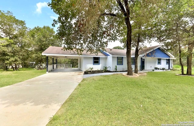 ranch-style home with a front lawn and a carport