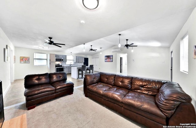 living room with vaulted ceiling and ceiling fan