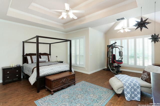 bedroom with ceiling fan, dark hardwood / wood-style flooring, crown molding, and a raised ceiling