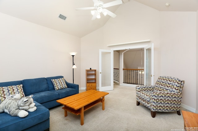 living room with ceiling fan, high vaulted ceiling, carpet floors, and french doors