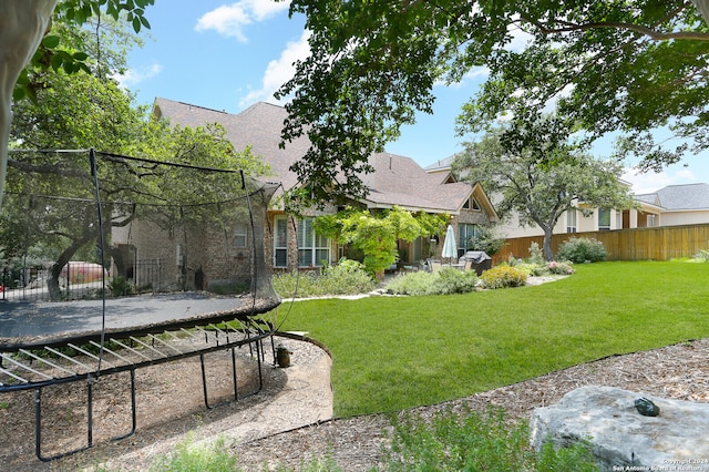 view of yard featuring a trampoline