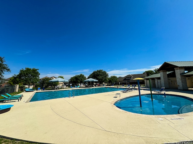 view of swimming pool with a patio area