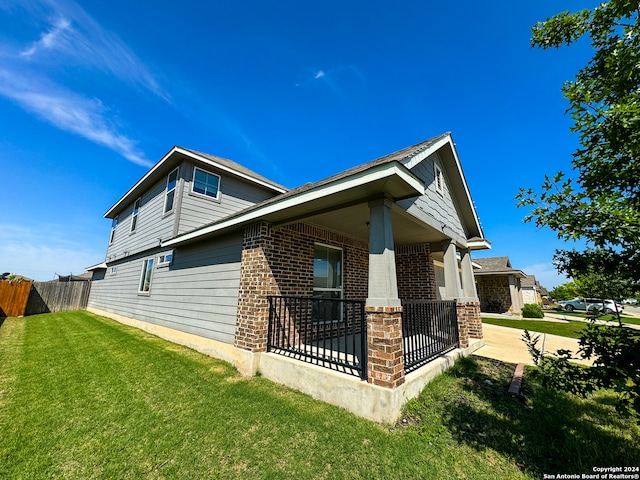 view of side of property featuring a yard