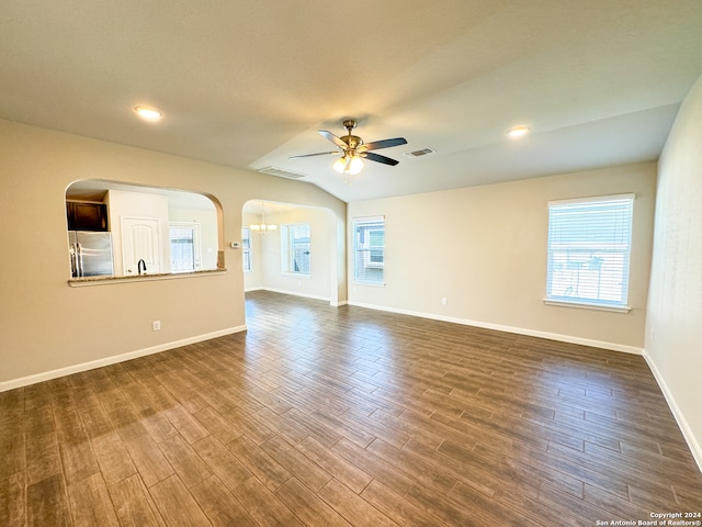 spare room with sink, lofted ceiling, ceiling fan, and dark hardwood / wood-style flooring