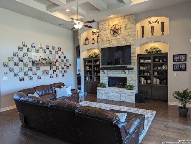 living room with dark hardwood / wood-style floors, built in features, coffered ceiling, and beamed ceiling