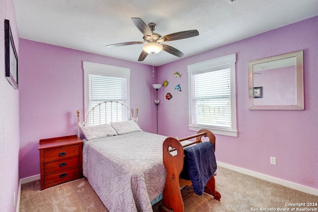 bedroom featuring ceiling fan and carpet floors