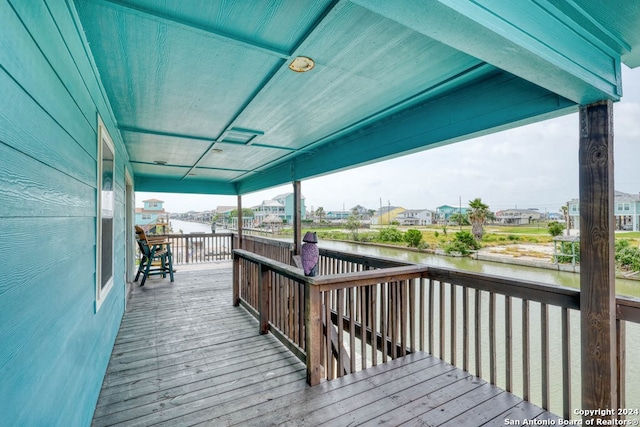 deck featuring a water view